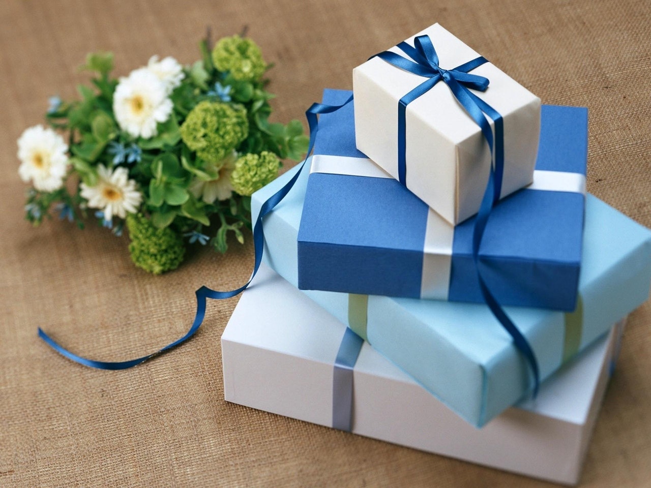 https://www.u-drive.com.au/wp-content/uploads/sites/103/2020/03/blue-gifts-wrapped-stacked-on-top-of-each-other.jpg